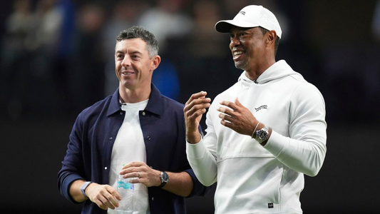 A picture of Rory Mcllroy and Tiger Woods standing next to each other at the new TGL Golf tournament.